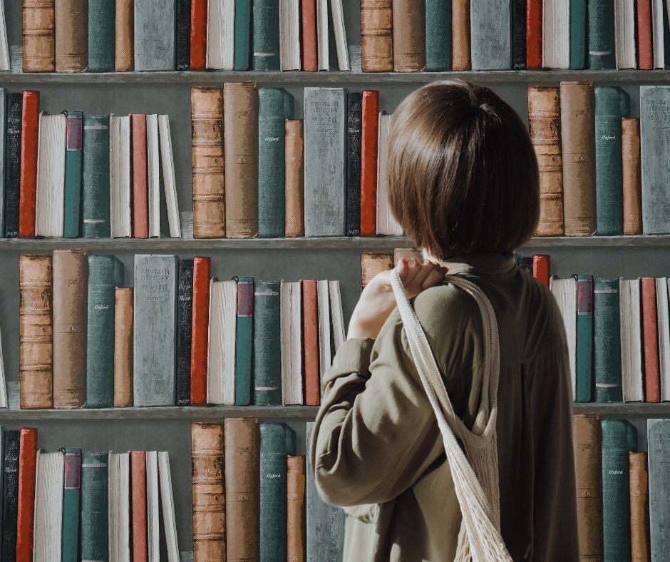 Woman looking at books on a shelf